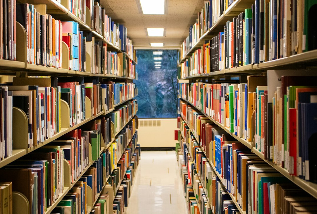 Rows of books in a library aisle