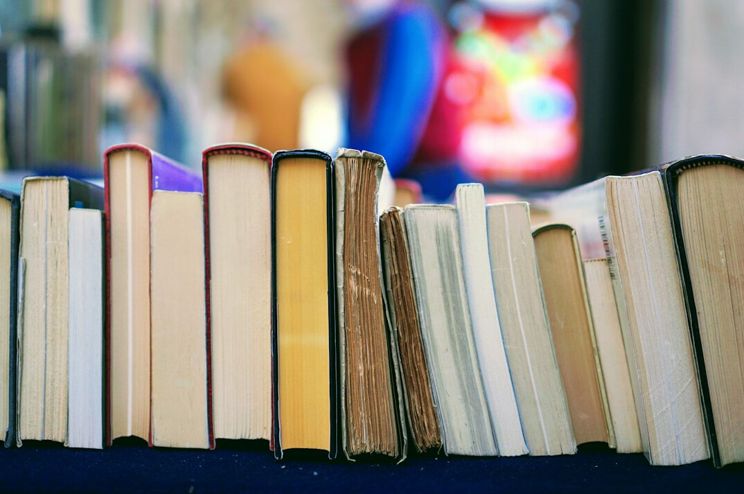 Stack of hardcover novels on a table