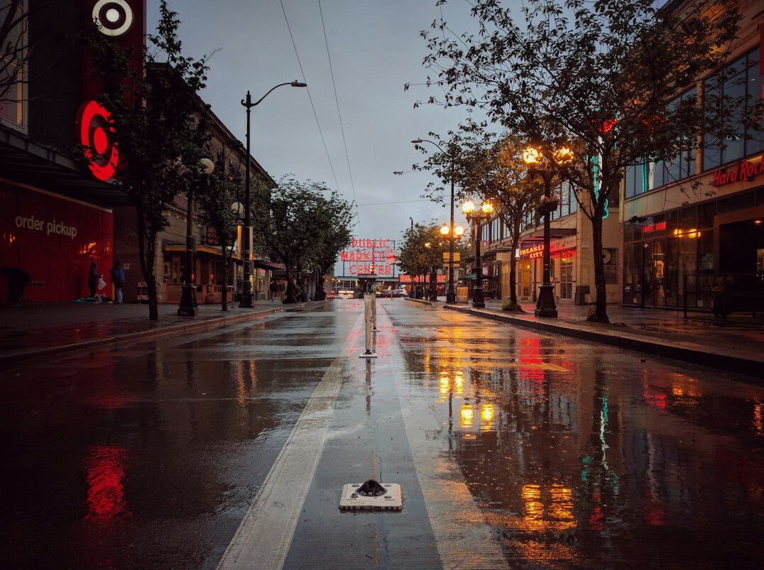 Rainy city street at night with reflections